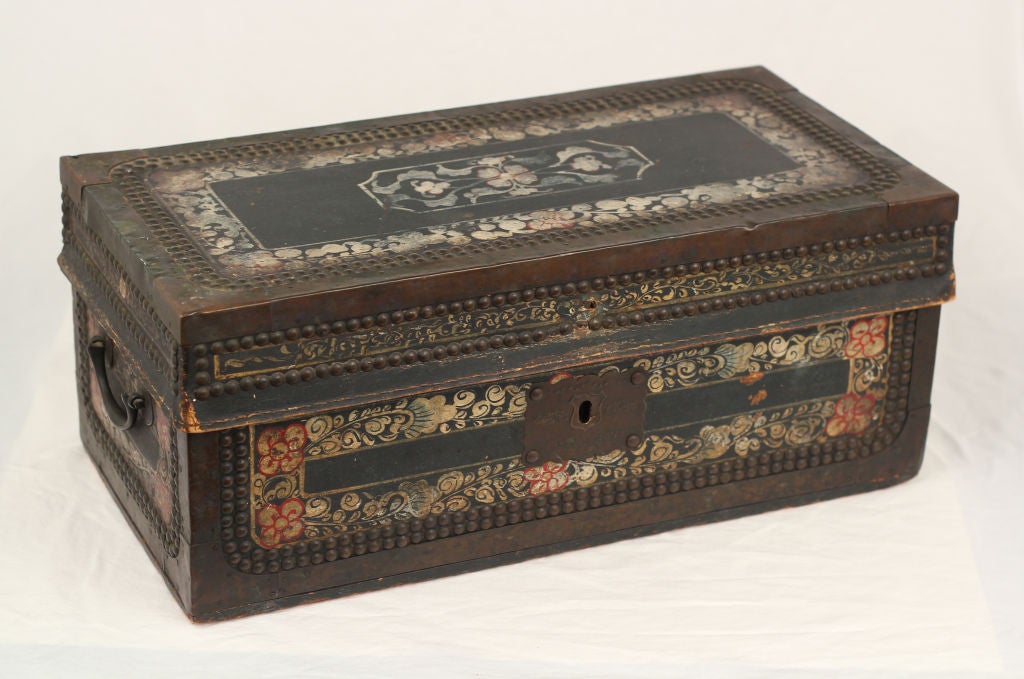 This is a very rare small version of the painted leather trunks made in China to hold silk exports for Europe.  Generally these trunks are coffee table size.  Each year I see fewer of them.  In 25 years I have not seen this size.