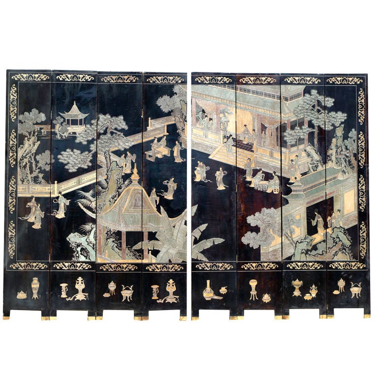 A large and well carved Chinese Coromandel Screen.  One side decorated with beautiful women in a walled pavilion.  The reverse side decorated with birds and flowers.