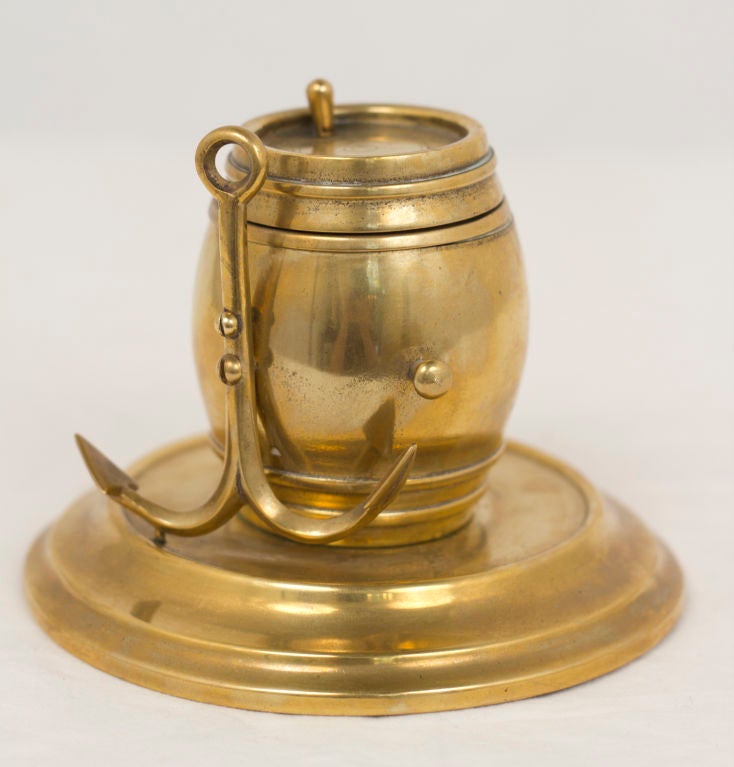 A great looking Victorian brass inkwell in the shape of a barrel with an anchor.