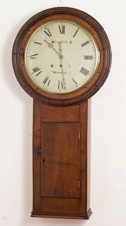 A classic Georgian Oak Tavern Clock made in England early in the 19th century.  This clock is running and is in good conditon.
