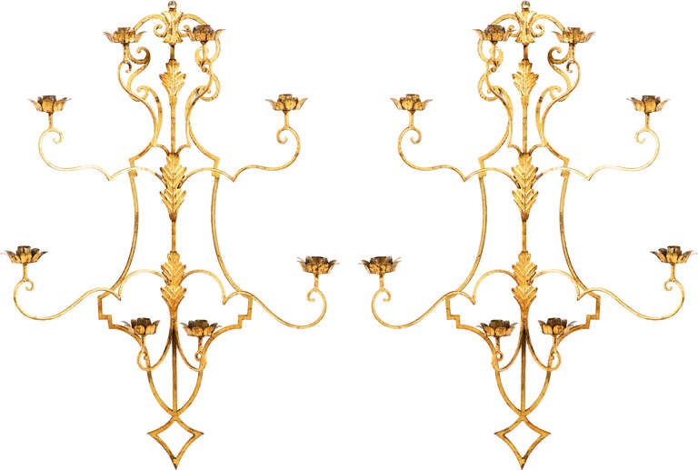 A chic and large pair of gilt bronze sconces collected in France.  We were unable to identify the maker but they do have a great look and hopefully someone  will know the maker and either tell me or sweep them up.