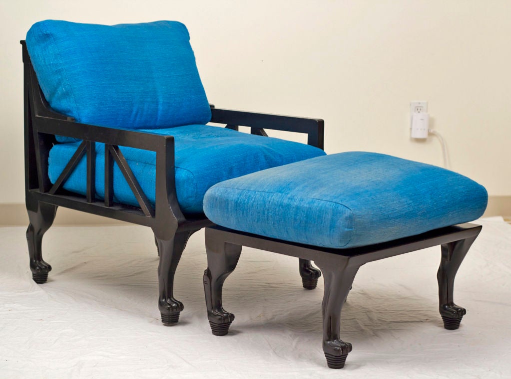 A very elegant pair of Egyptian Revival chairs with matching ottoman.  The cushions are electric blue raw silk.  The chairs where inspired by John Dickinsons designs and where made by Randolph and Hein.
