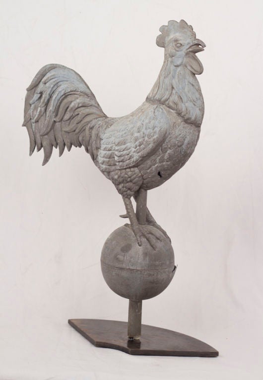 A handsome and large antique zinc rooster Weathervane on a later steel stand.