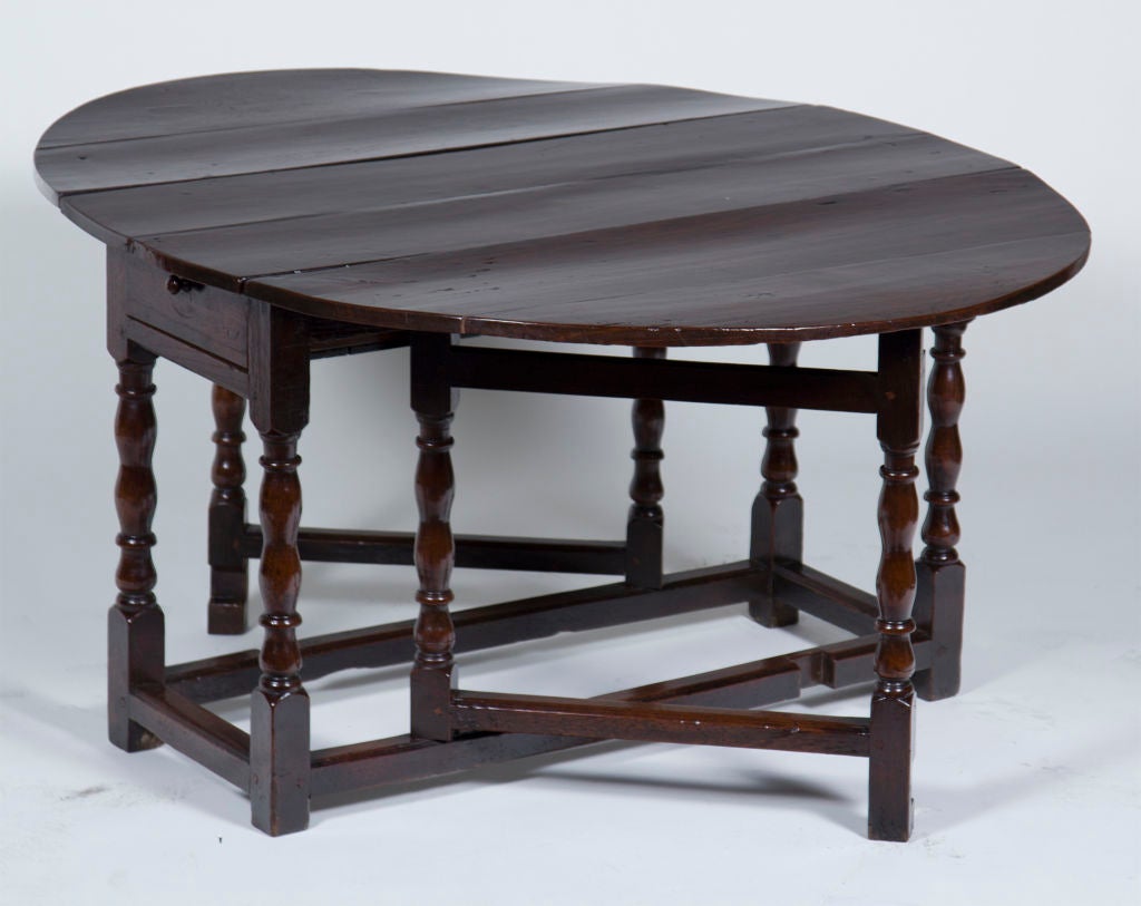 A Classic 19th century oak drop-leaf table.