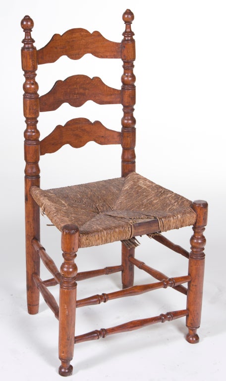 A charming small and very old turned side chair made in Spain or France about 300 years ago.
