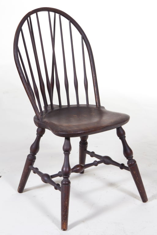A handsome smaller scaled Windsor chair on turned legs with an nice older finish.