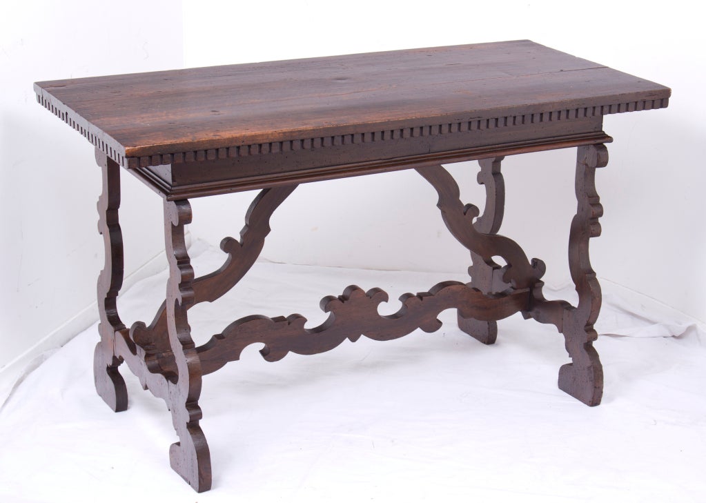 A very good looking fruitwood trestle table made in Italy, late in the 19th century.