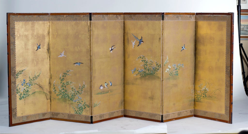 A well painted Japanese mid size six panel screen featuring birds and flowers on a gilded ground.  Signed Kan Yusei Hitsu.  We believe the screen is early 19th century.  The frame is being professionally restored and will be a rich black lacquer.