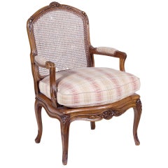 Old French walnut armchair, one of two.