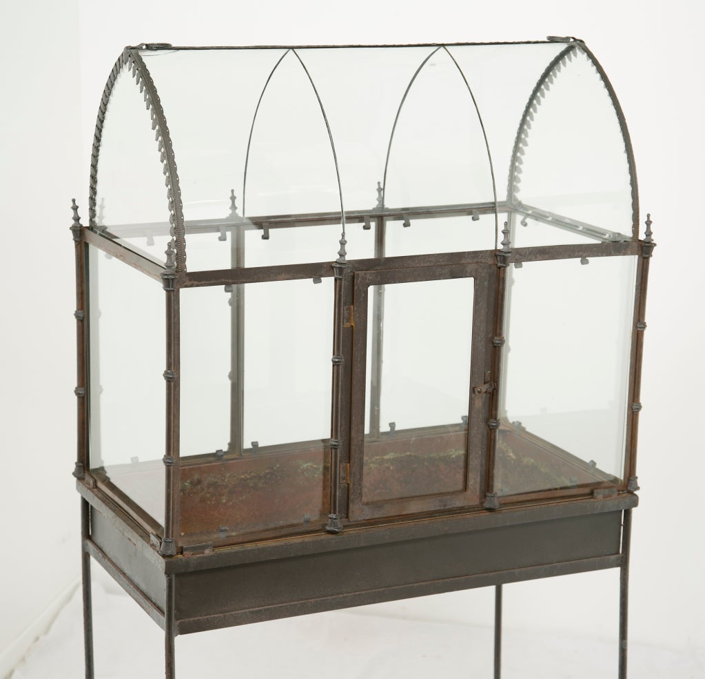 A rare old gothic revival terrarium on a later custom painted metal stand.