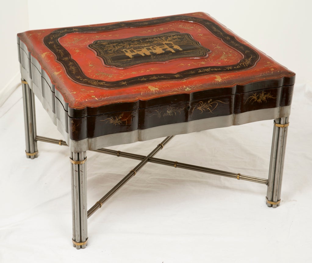 A rare large Chinese export papier-mâché lacquered cinnabar and black scalloped robe box with gilt decoration. On a later steel and brass matching stand. This is the largest Chinese export robe box I have seen. Ex collection Billy Baldwin. We date