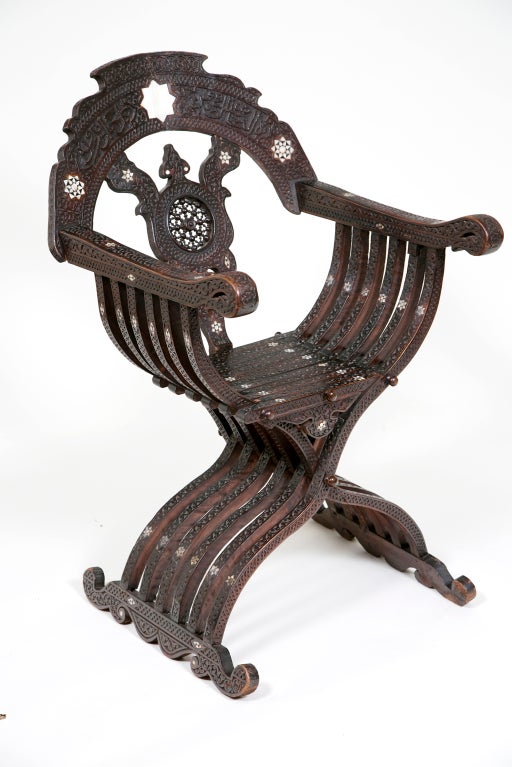 This elaborately carved and inlaid chair was made about 1870 some where in the old Ottoman Empire.