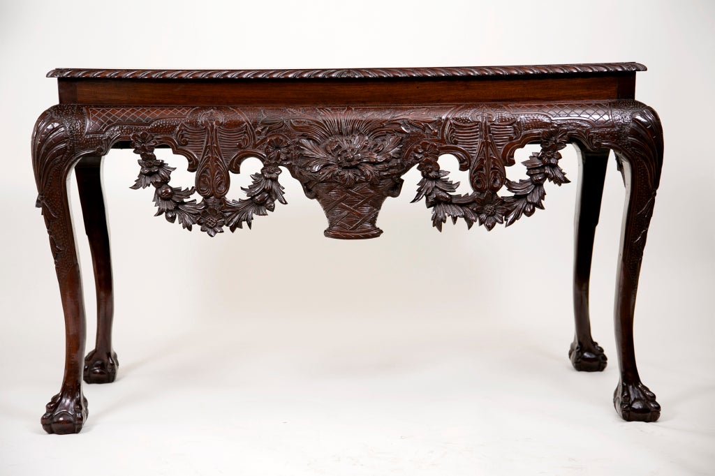 A very good 19th century copy of a mid-Georgian Irish console or side table. We think this one was made, circa 1870. The top is replaced using period wood. We like the carving and compressed ball and claw feet.