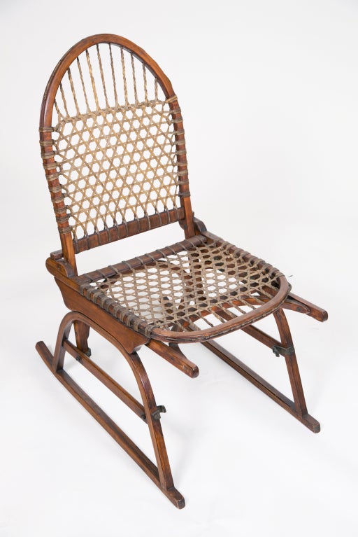 A decorative pair of old  adirondack chairs made from snow shoes.  These are suprisingly hard to find and great by a fireplace.  Smaller in scale.  Great for children.