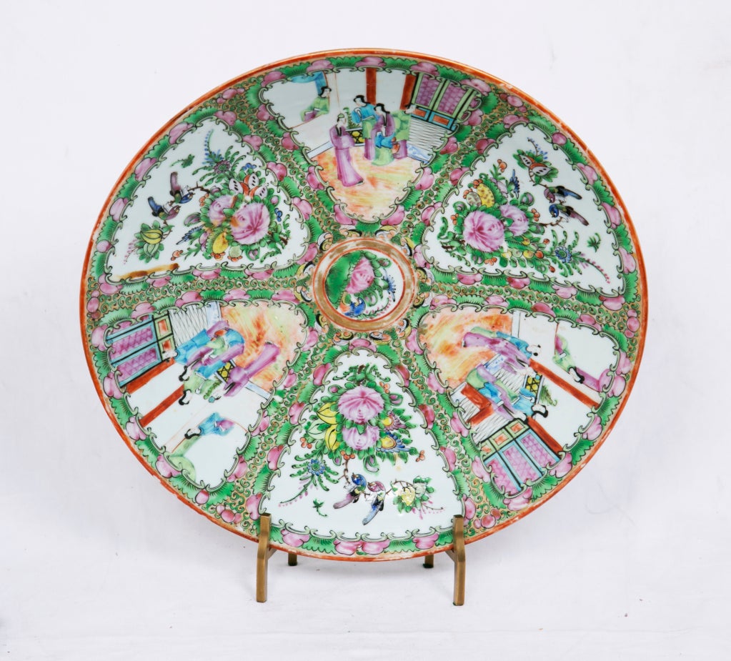 A rare large Chinese export porcelain charger decorated by hand in famille rose enamels.  This porcelain is named for the pinkish rose enamels.  This pattern is called 