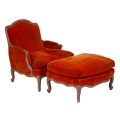 A Large Painted French Armchair and Ottoman