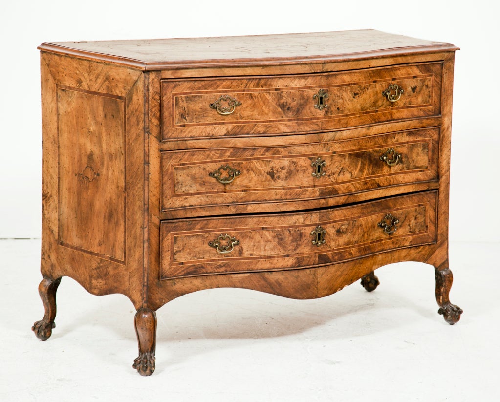 A very nice Italian Serpentine chest / commode in fruitwood with boxwood and olive wood inlays on poplar secondary wood.   Standing on four graceful and whimsical paw feet that appear to be original.  We believe this piece was made in area around