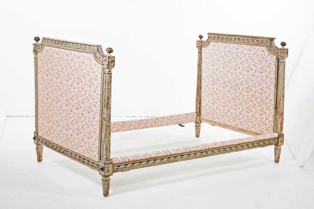 A very nice Louis XVI carved and painted bed or daybed made in France during the last quarter of the 18th century. Painted in a wonderful old chipped oyster color. From the estate of a a titled lady. Inside measurements are 76