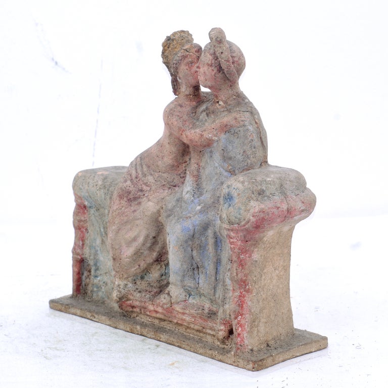 A wonderful copy of an ancient Etruscan couple seated together.  These objects where made for sale to wealthy tourists in Italy and Greece.   Often they where originally sold as 