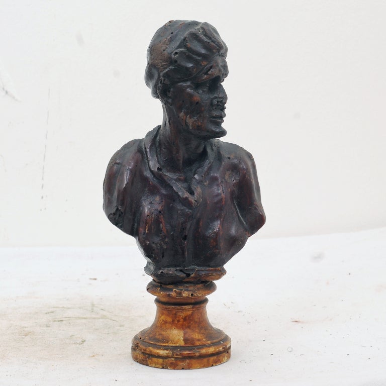 A charming and early caring of a bust probably made in Italy early in the 18th century.  One of a set, others available.  We like the quality of carving,  The color and the patina.