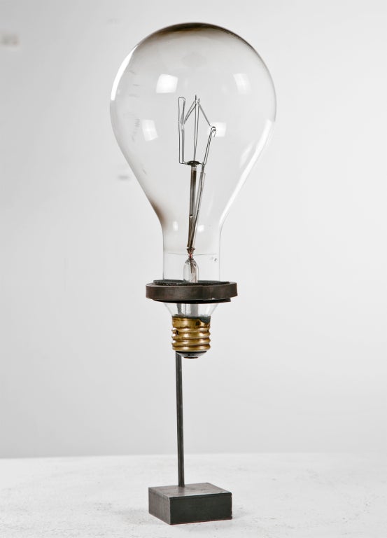 We love these early light bulbs and buy them when ever we see them. This is unusually large and probably was made in the 1920's. Mounted on a later custom steel stand. A wonderful and curious object. A rare survivor and an interesting bit of
