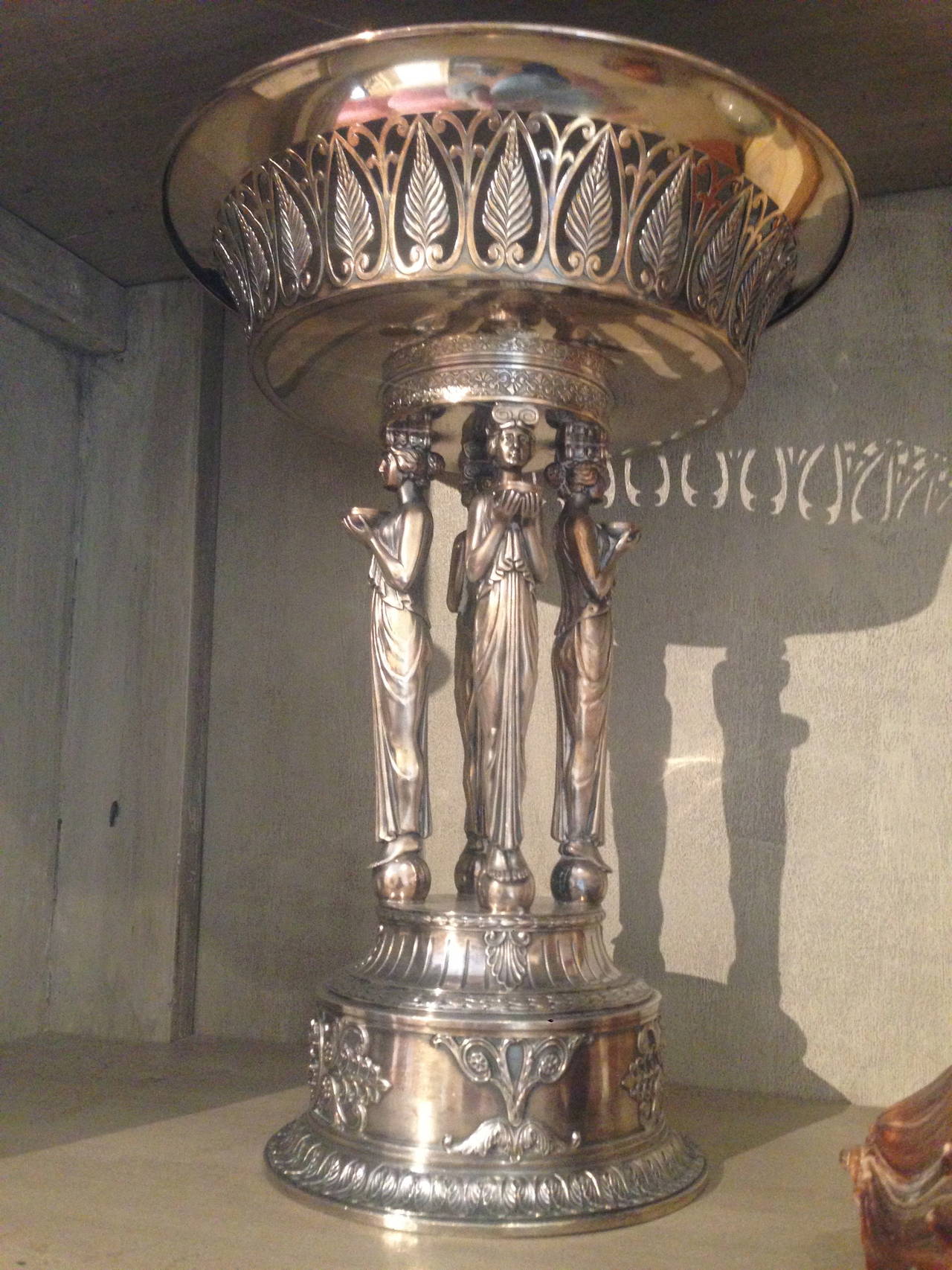 Early 20th century French silver stylized compote with four maidens in draped gowns holding a pierced acanthus bowl.