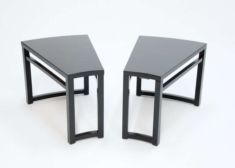 A pair of handsome wedge side table by Paul Laszlo for Brown and Saltman. The tables have been black lacquered. The table are the same except they are from different production runs and one is heavier than the other in weight only.