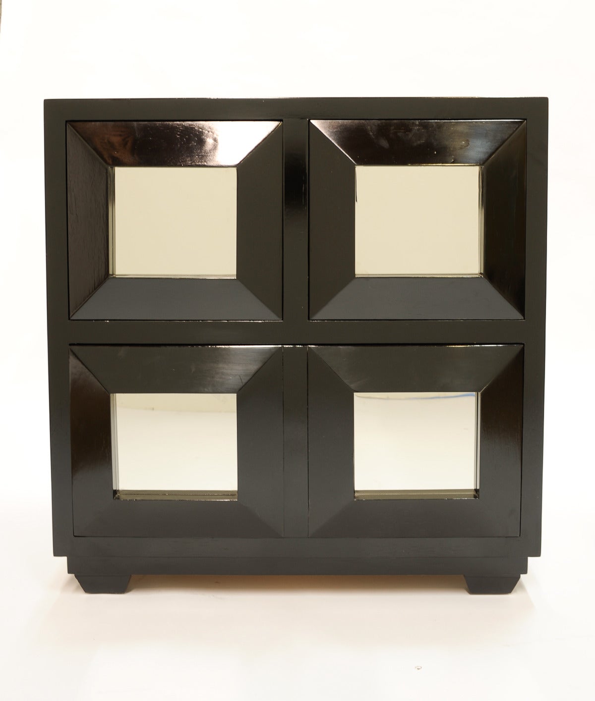 Each chest has two single drawers and a double on the bottom. They are refinished in a black open grain lacquer. The front are mirror polished stainless steel. Wonderful and truly functional for a home or office. They are both bold and refined.