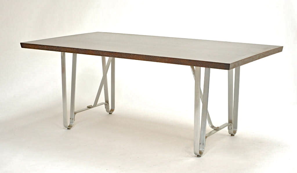 Philip Agee's workshop made the pickled top. The trestle legs are found Industrial brushed aluminum.