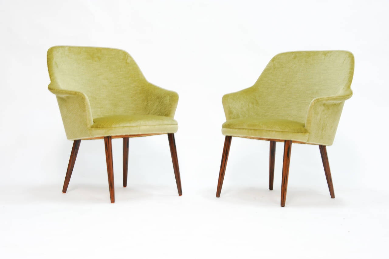 A pair of Danish armchair in the manner of Ejvind Johasson. These are are wonderful and elegant in design and form. They are the refined deisgn work of Ponti, Diztel and Ejvind Johasson. Gio Ponti did a pair that are very close for singer and sons.