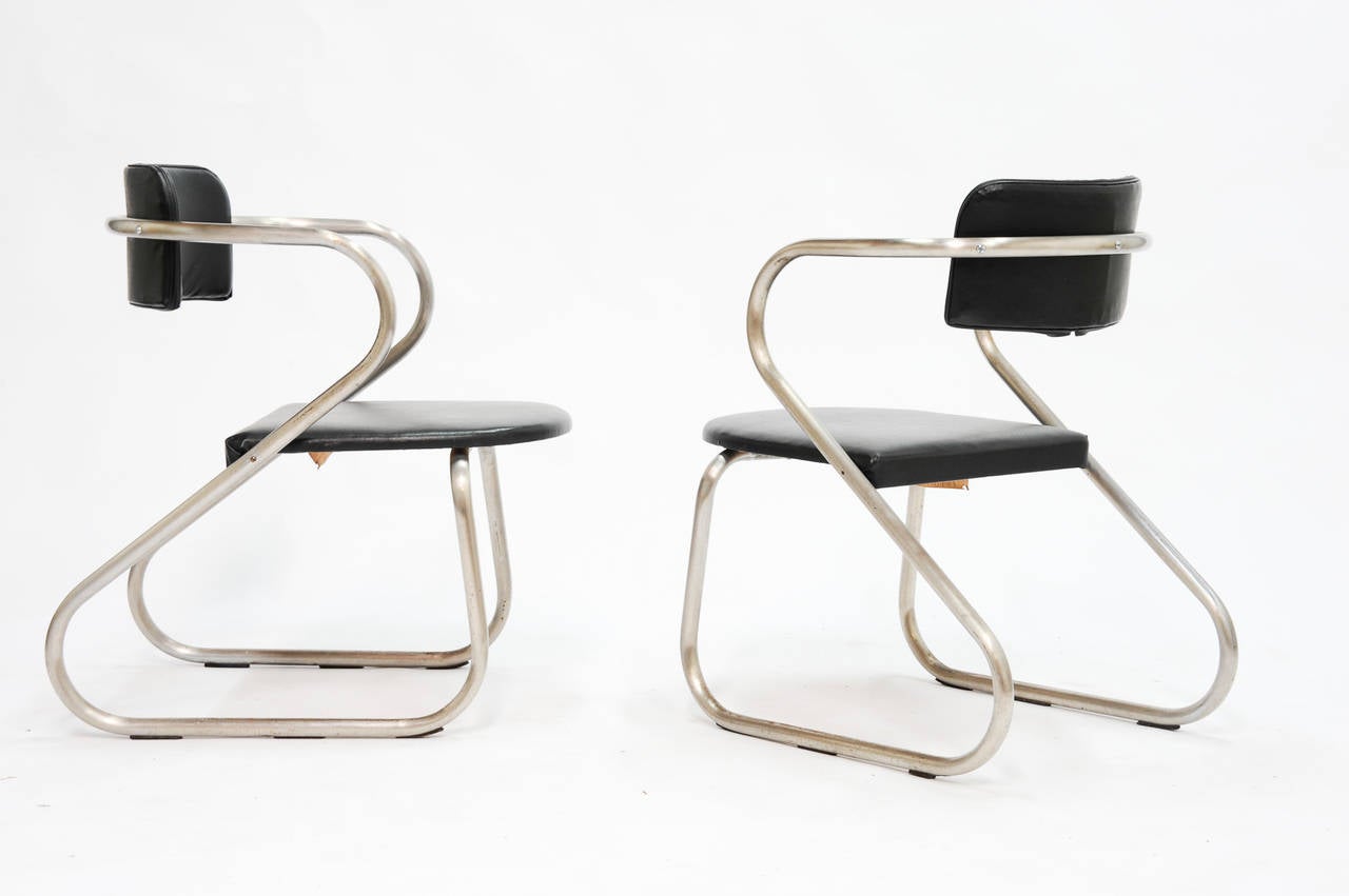 A wonderful pair of armchairs by the Virtue brothers of Long Beach, CA. These are chair are heavily influenced by the chairs that Richard Neutra designed. The lines and details are playful and functional. The chairs are original and have not been