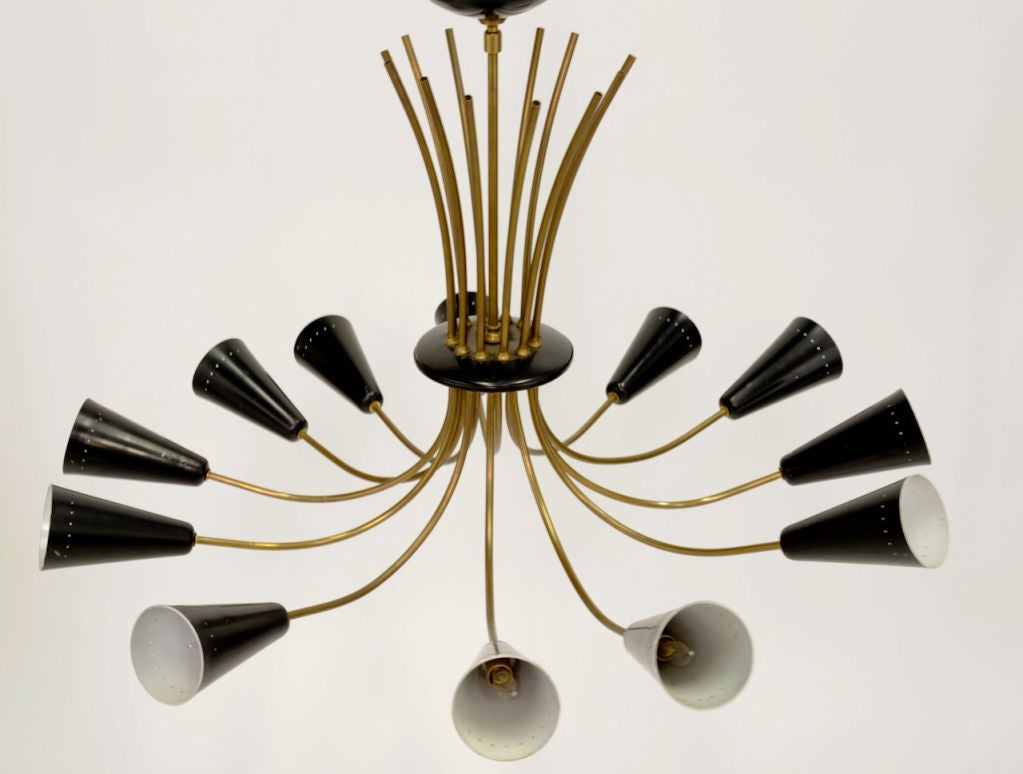 A handsome chandelier by lightolier in the manner of the italian lighting master Gino Sarfatti.