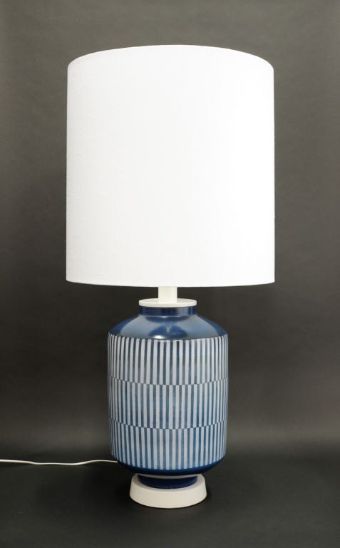 A large scale table lamp with a custom shade by AH KAg of Switerland.  This is a finely detail lamp with a white lacquered base and neck. Shade is 22