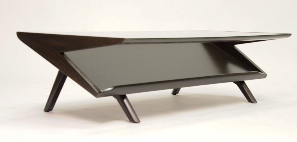 This is a wonderfully scaled Coffee table by John Keal for Brown and Saltman. A second unrefinshed table is available.