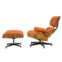 Eames 670 and 671 Lounge Chair in "Hermes" orange leather