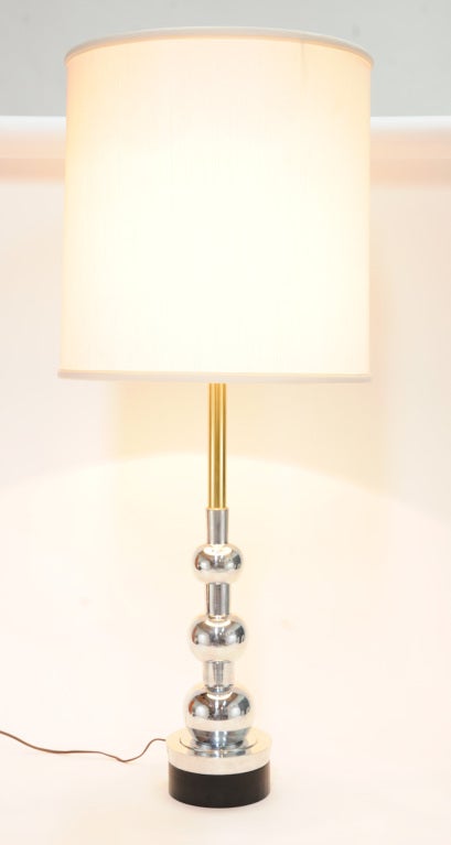 Polished to a mirror finish is the elegant pair of Stiffel table lamps. An elegant combo of aluminum and brass. Priced as a pair without shades.