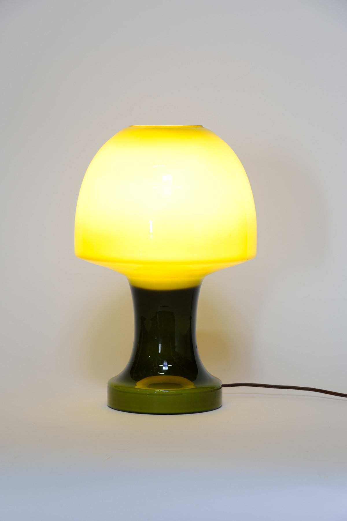 An amazing Italian green mushroom lamp that simply glow when light up. A deep and rich green glass that speaks of the quality glass blowing and refinement of the Italians.