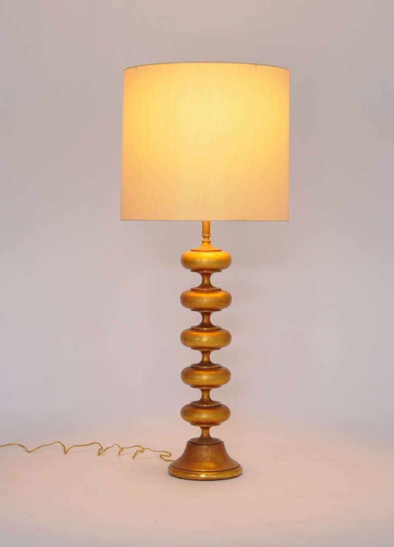 A pair of monumental faux gold gilded Rembrandt materpiece lamps. Shades and diffusers not included.