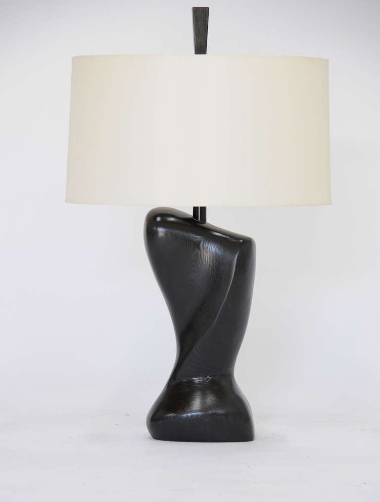 This wonderfully sensual pair of black lacquer lamps is attributed to Heifetz, who achieved widespread recognition as the winner of a MoMA-sponsored lighting design competition in the early 1950s.  The Connecticut company was founded by renown