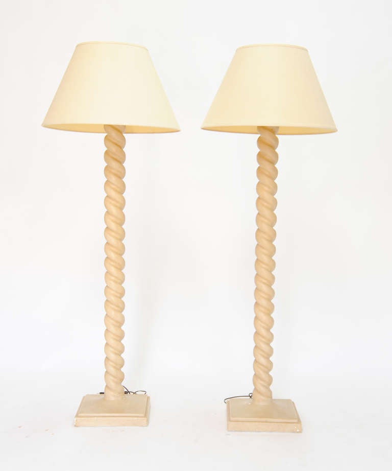 A pair of monumental taylor plaster floor lamps.