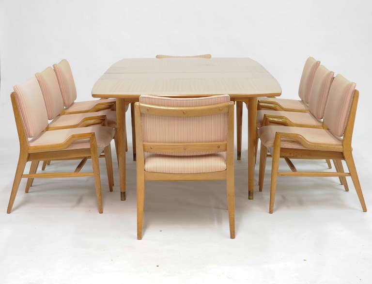 A Wonderful set of eight chairs and dining table by John Keal for Brown and Saltman.   The table is a ribbon mahogany and comes with two leaves that are 16