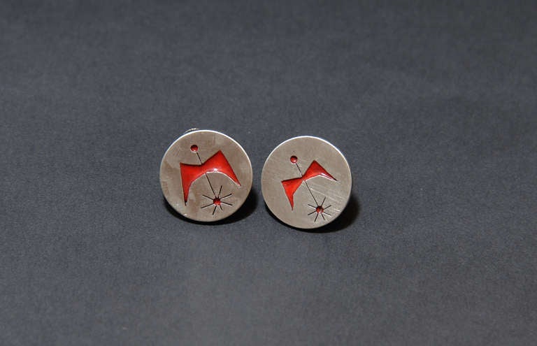 A wonderful pair of Betty Cook Sterling Silver Earrings.  The pieces feature the Atomic  Rising Phenix Bird in red enamel. The set is branded Cooke

Betty has been designing jewelry since she graduated from the Maryland Institute in 1946.  Back