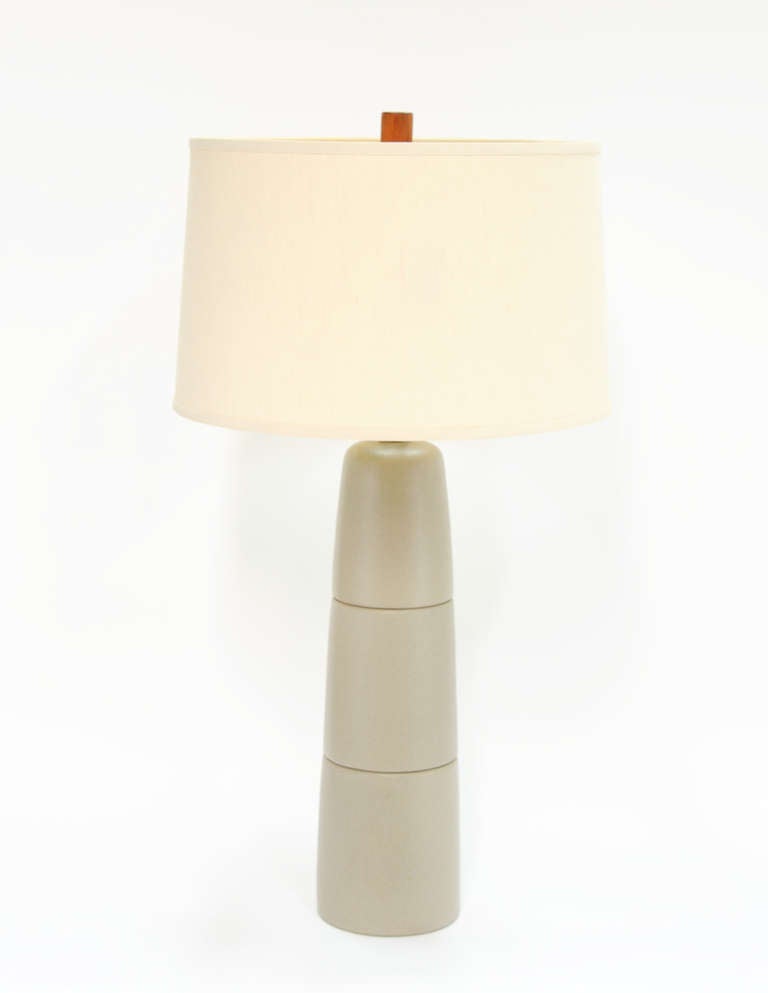 A grand stoneware lamp by the modern ceramic masters Gordon and Jane Martz. The lamps is clearly labeled and refined in its scale and form. The original shade has its label as well.