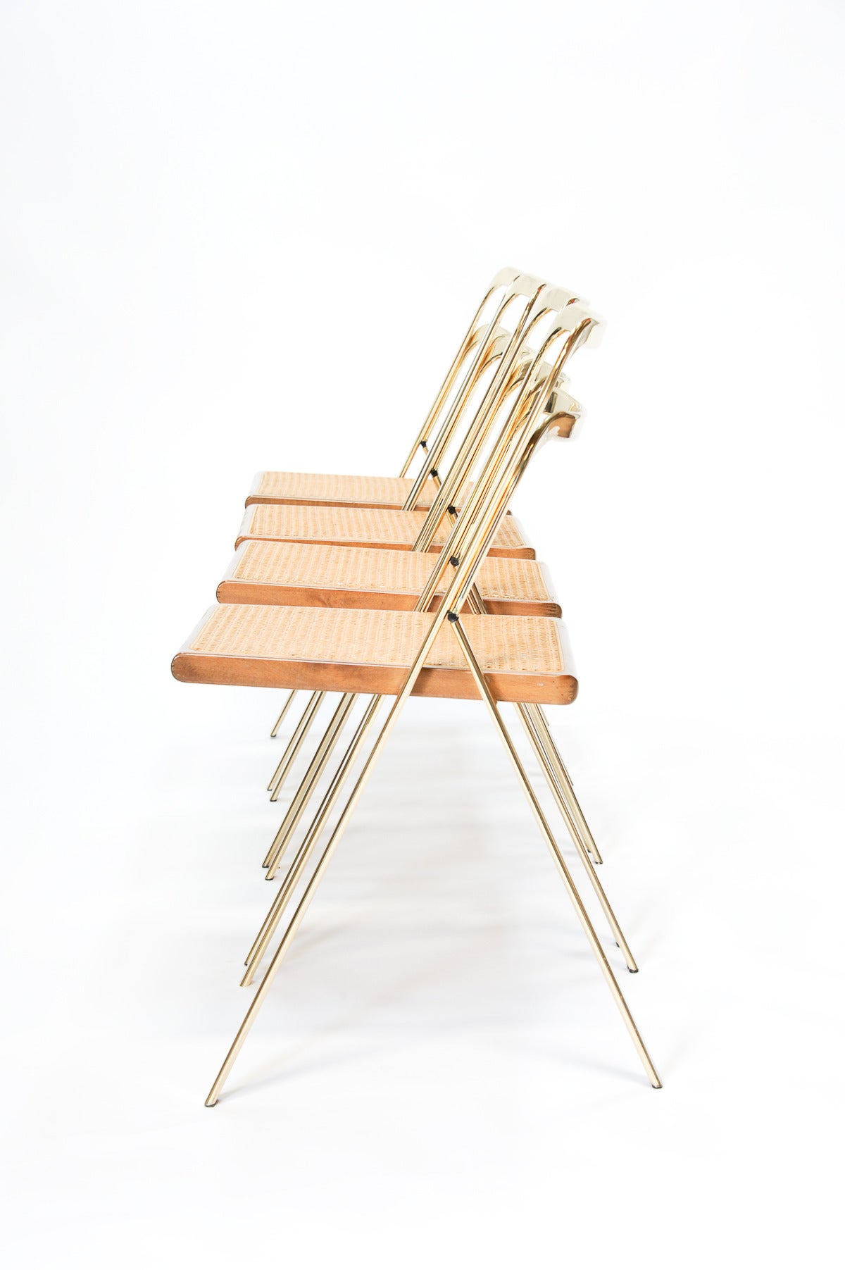 A wonderful set of folding chairs by Cidue. They are refined and elegant in their style and structure.