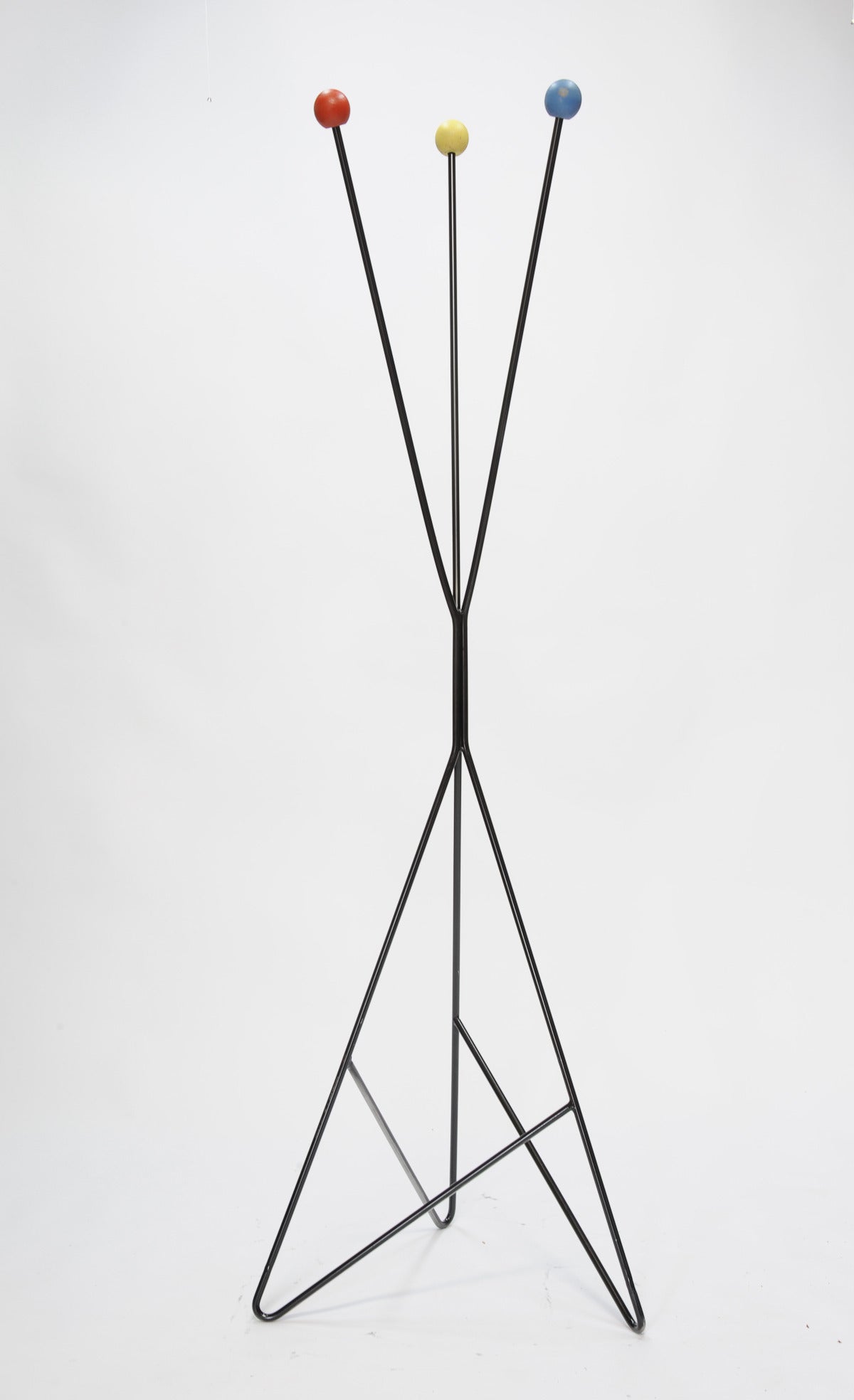 A playful and wonderful coat rack in the manner of Greta Grossman. It is in the same size and colors of her folding screen. Well-built and designed.