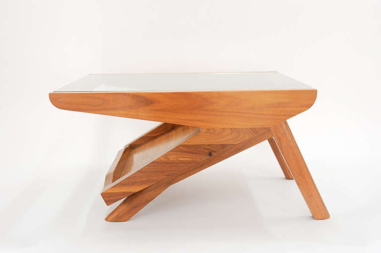 This side table is an out of production piece by LA design frim Modernica.  The table is solid walnut and has that wonderful Neutra design referrence to the top.