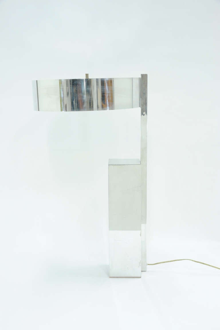 A wonderful table lamp that with a reflective sides and shade