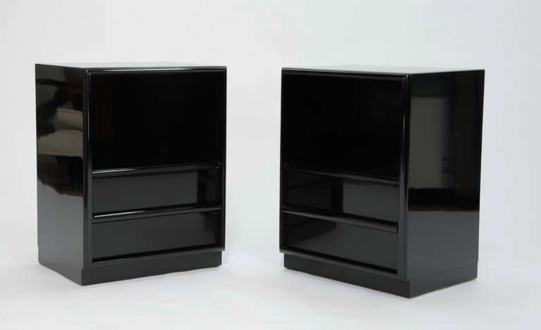 A sleek pair of nightstands by T.H. Robsjohn-Gibbings for Widdicomb.