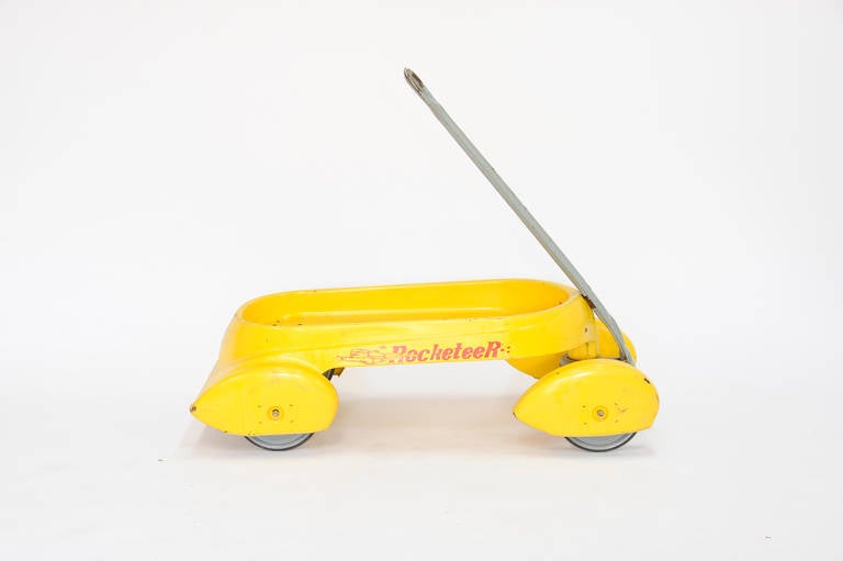 A wonderful toy for child and adult alike. The wagon is a bright yellow and has been loved.  The company existed for just one year in the early 1990s and preoduced just a small number of these wagons, Handle Height is 40.5 and add 33