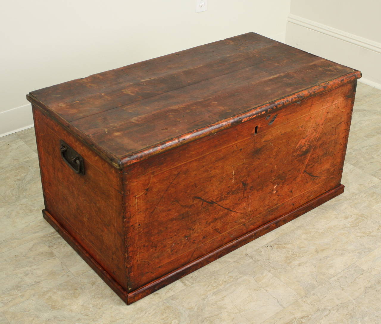 A great old blanket chest, carefully painted in faux dark wood, probably to simulate the look of a finer wood.  Interesting grain paint, and a most interesting painted inner boarder on the front and sides in the style of painted Regency furniture. 